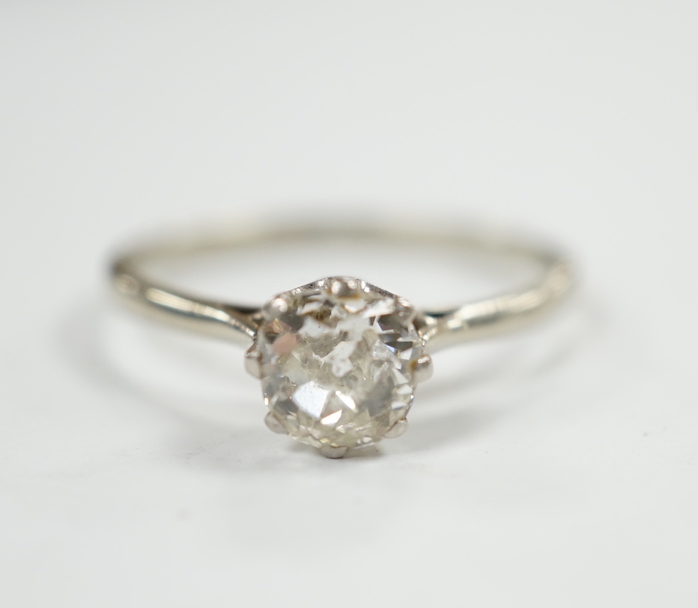 A white metal and solitaire diamond set ring, size Q, gross weight 2.1 grams